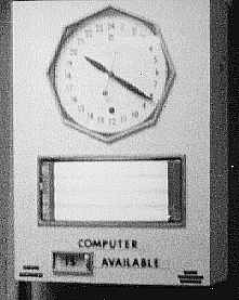 24-hour clock and Computer Is Available sign