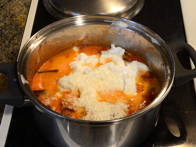 Adding mozzarella, grated parmesan cheese