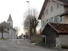 Now image: church and entry to village