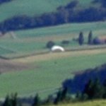 Paraglider descending from the Chasseral