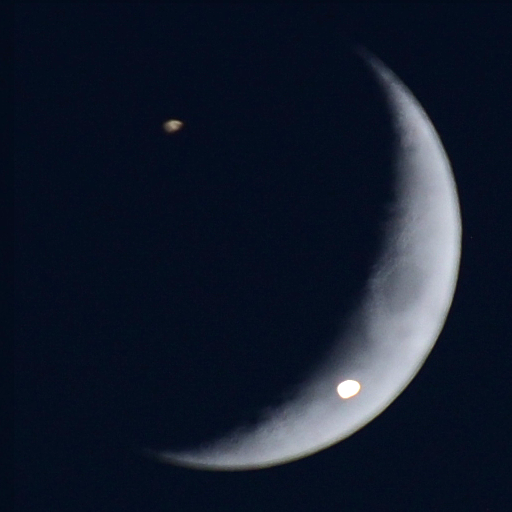 Jupiter and Saturn superimposed on the crescent Moon